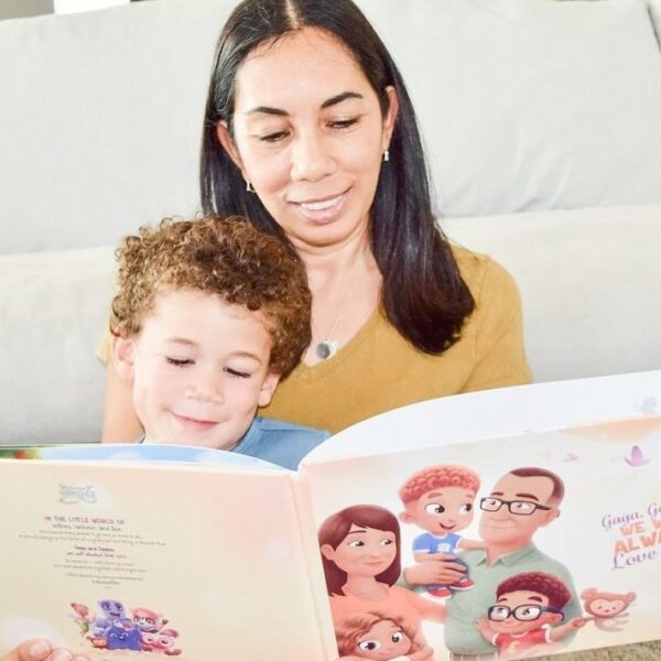 A grandmother reading a Hooray Heroes personalized book for grandparents and up to three children to her grandson.
