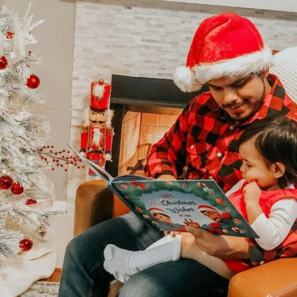 dad and kiddo reading a hooray heroes personalized christmas book