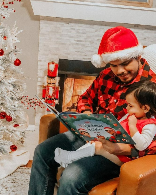 dad and kiddo reading a hooray heroes personalized christmas book
